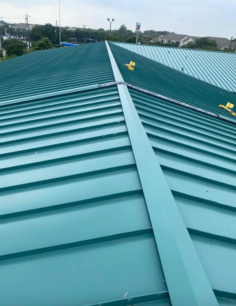 Green commercial metal roof ridge and valley for Metal Roof Repair in Lemay